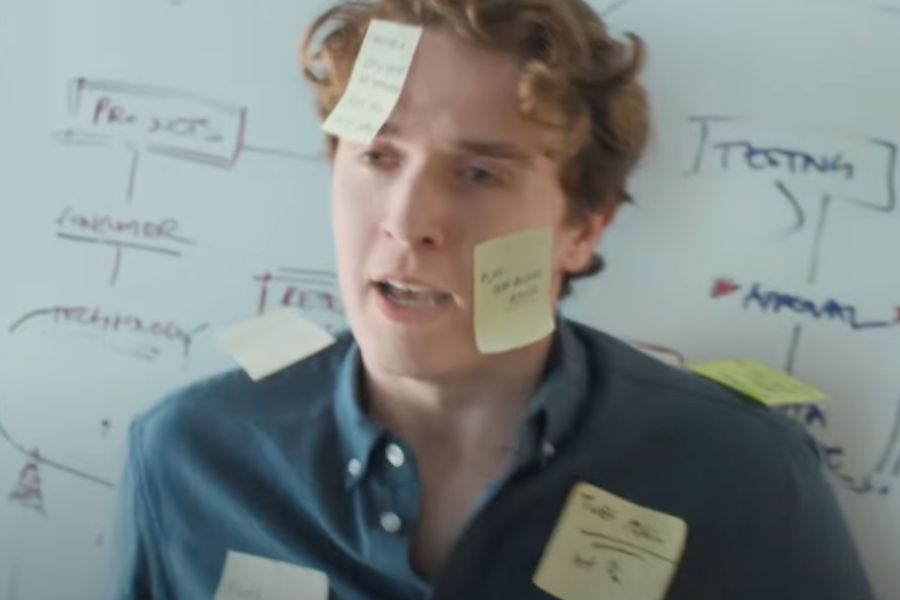 KitKat ad features man weighed down with office burdens