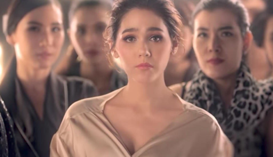 Sabina teases with peek-a-boo bra ad