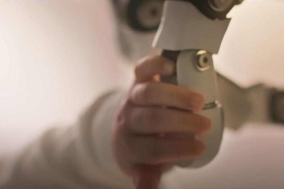 A robot touches a baby: But how does that help a mobile network?