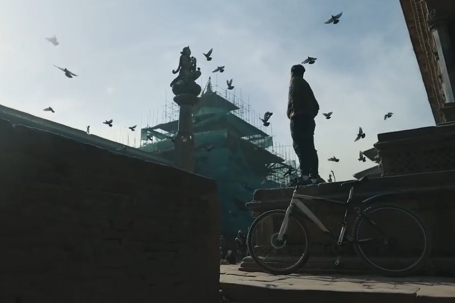 Mobile carrier recites a poem for progress in Nepal