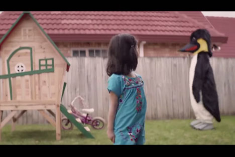 Nonplussed kids not concerned about bike-stealing penguin
